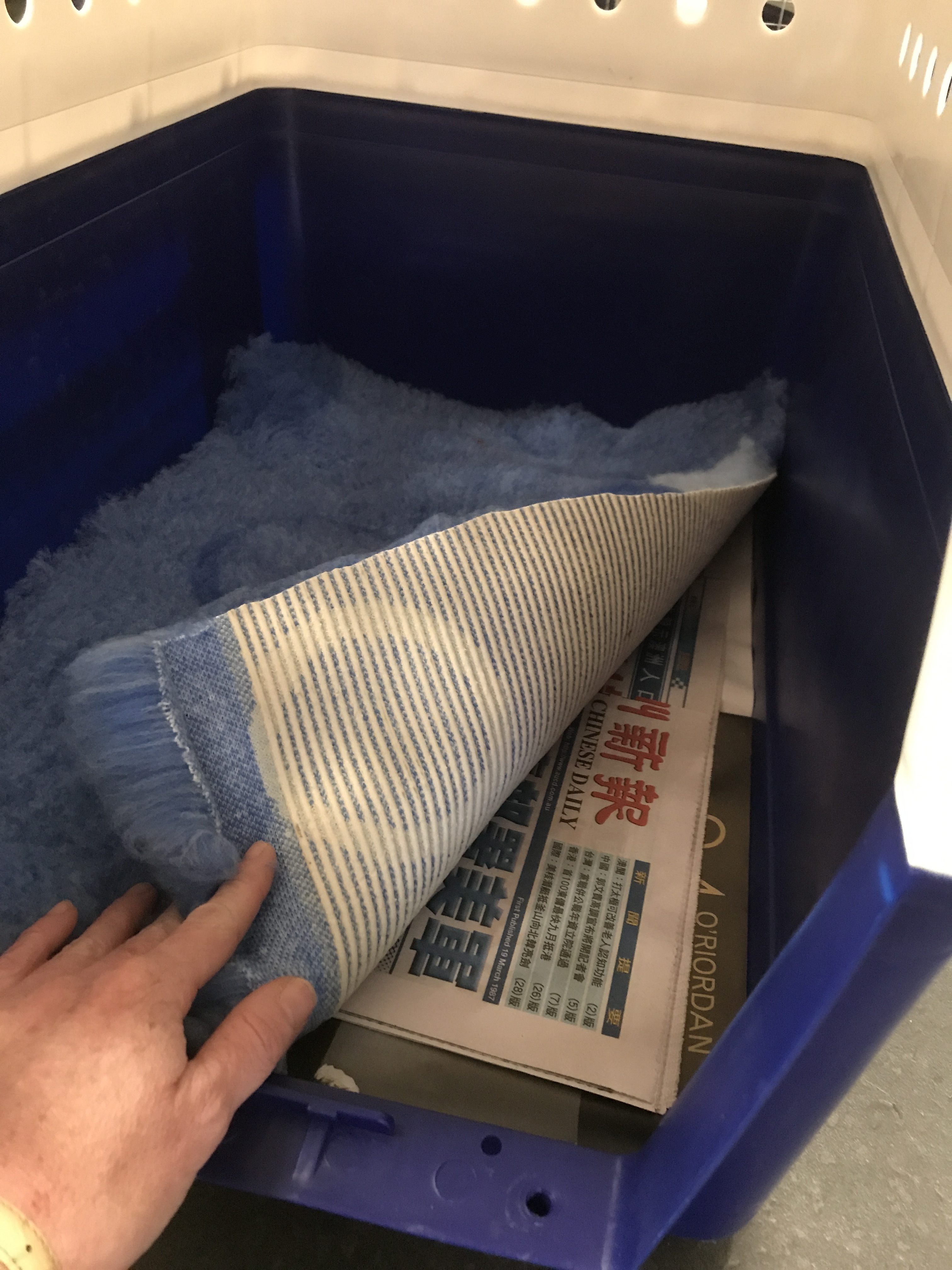 Crate showing newspaper and stay dry